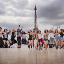 High School Semester Abroad! group jumping in front of the Eiffel Tower